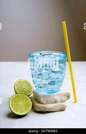 lemonade with lemons in clear blue glass with ice Stock Photo