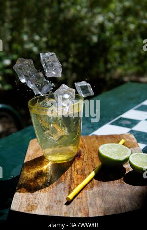 ice cubes falling into glass Stock Photo