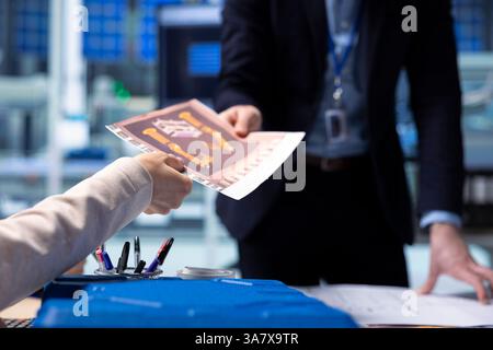 Industrial plant research and development department manager handing over facility upgrades schematics to interested investor. Factory management giving shareholder conveyor belts blueprints, close up Stock Photo