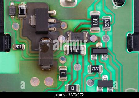Damaged Electronic Circuit Board with Burnt Components Stock Photo