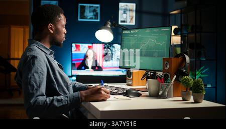 Male financial advisor examines monthly income and expenses to ensure a strategic plan on products and services. African american expert analyzing revenue balance, accounting analysis. Camera A. Stock Photo