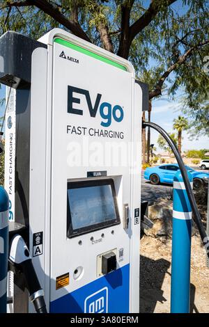 Cathedral City, CA, U.S.A. - Closeup of an EVGO electrical car charger at a charging station. Stock Photo