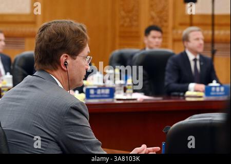 Peking, China. 28th Mar, 2025. Ola Källenius, Member of the Board of Management of Mercedes-Benz, sits in the Great Hall of the People. China's head of state and party leader Xi promoted China as a safe investment location in front of international CEOs. Credit: Johannes Neudecker/dpa/Alamy Live News Stock Photo