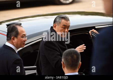 Peking, China. 28th Mar, 2025. Wang Yi, China's Foreign Minister, leaves the Great Hall of the People. State and party leader Xi had received important CEOs of global companies there. Credit: Johannes Neudecker/dpa/Alamy Live News Stock Photo