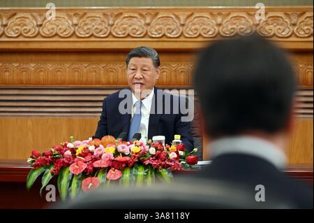 Peking, China. 28th Mar, 2025. Xi Jinping, China's head of state and party leader, speaks at a meeting with international CEOs in the Great Hall of the People. Xi promoted China as a safe investment location. Credit: Johannes Neudecker/dpa/Alamy Live News Stock Photo