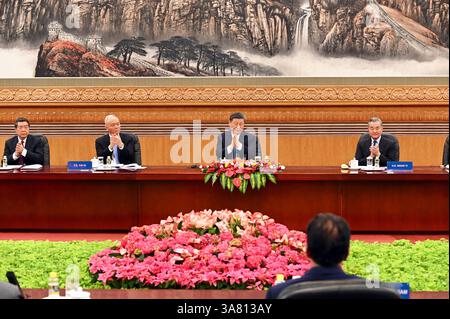 Peking, China. 28th Mar, 2025. He Lifeng (l), China's Vice Premier, sits next to Cai Qi, Secretary of the Secretariat of the Central Committee of the Communist Party of China, Xi Jinping, Chinese State and Party Leader, and Wang Yi, China's Foreign Minister, in the Great Hall of the People. Xi promoted China as a safe investment location in front of international CEOs. Credit: Johannes Neudecker/dpa/Alamy Live News Stock Photo