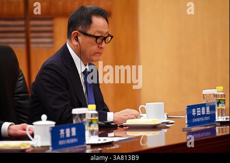 Peking, China. 28th Mar, 2025. Akio Toyoda, Chairman of the Supervisory Board of Toyota, sits in the Great Hall of the People. China's head of state Xi praised China as a safe investment location. Credit: Johannes Neudecker/dpa/Alamy Live News Stock Photo