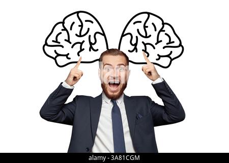 Smart happy businessman pointing on drawing of big brains above his head. Concept of thinking, idea, troubleshooting Stock Photo
