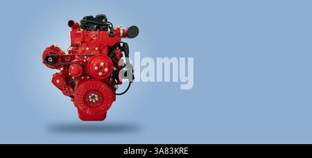 Red diesel engine on blue background. Stock Photo