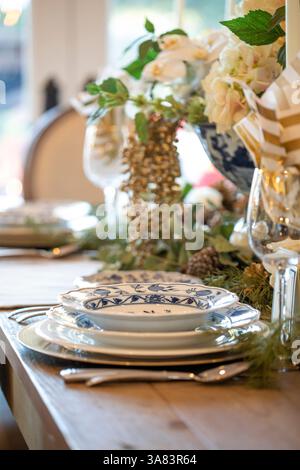 Holiday place setting on table from side view vertical Stock Photo