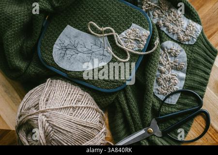 Embroidery Work in Progress on a Green Sweater Stock Photo