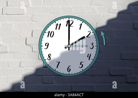 The clock shows its hands moving back from 3 a.m. to 2 a.m. in autumn. The end of daylight saving time. The time transition. Against a brick wall. Stock Photo