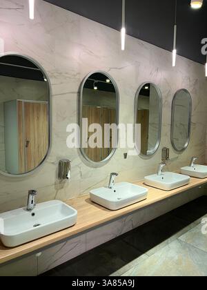 Modern restroom interior with stone gray tiles. interior of public ...