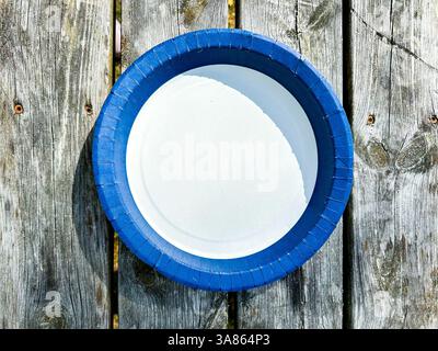 Empty blue and white Plate Top View Isolated on wooden Background. High quality photo Stock Photo