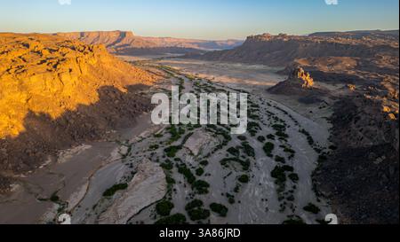 Aerial of the sunset over rocky mountains around Zouar, Tibesti Mountains, Chad Stock Photo
