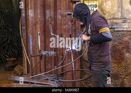 Craftsman at work in a workshop in Marrakesh, Morocco Stock Photo