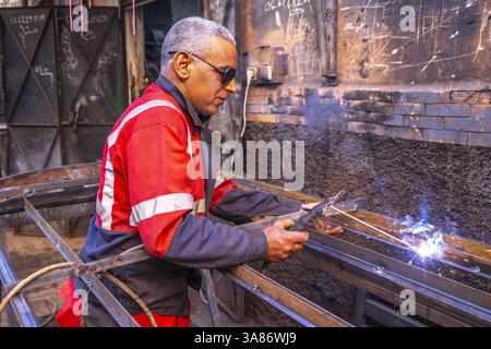 Welder at work in a workshop in Marrakesh, Morocco Stock Photo