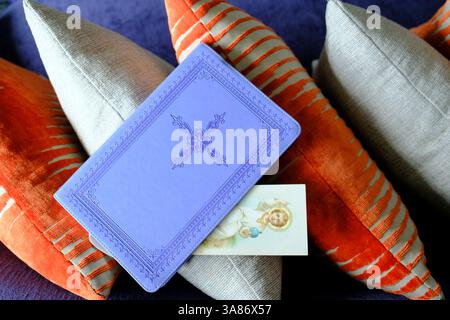 Prayer at home, Bible with a religious image on a cushion, Malaysia Stock Photo