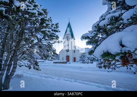 View of Hafnarfjaroarkirkja church at sunrise in winter, Hafnarfjorour, Reykjavik, Iceland Stock Photo