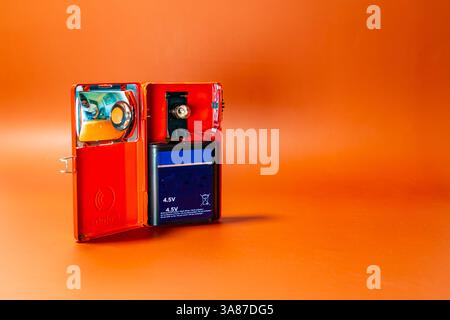 Open antique lantern on an orange background Stock Photo