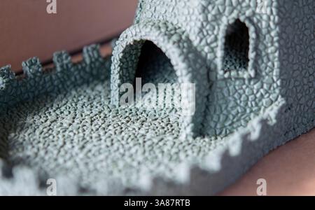 Small object created from molten plastic on 3D printer. Three-dimensional model printed on 3D printer from plastic. Modern new 3d printing technology. FDM technology. Additive progressive technologies Stock Photo