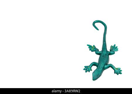 Green rubber lizard toy, top view, isolated on white background. Playful and fun, perfect for children's designs, educational materials, or toy store Stock Photo