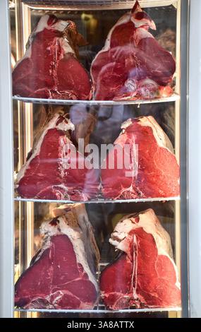 Large fresh raw steak Florentine meat slices display in store window Stock Photo
