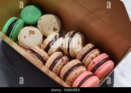 Assorted macaroon cookies in a paper take out box Stock Photo