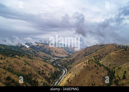 The sky is cloudy and the mountains are brown Stock Photo