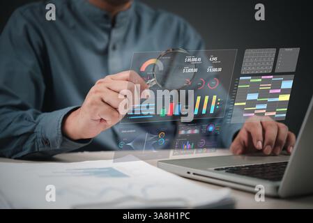 Business data dashboard, using laptop and magnifying glass to analyze charts, reports, and statistics for digital marketing and finance. AI analytics, Stock Photo