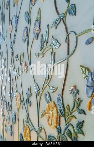 Abu Dhabi, United Arab Emirates - Jan 10 2024, Close-up view of a marble wall with patterns in the form of flowers and vines made of minerals Grand Mo Stock Photo