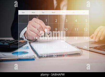 Business professional planning workflow solutions a schedule using a calendar overlay, highlighting time management and task prioritization. Stock Photo
