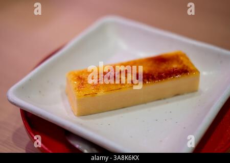 Catalana ice brulee, or a custard topped with a layer of caramelized sugar, similar to the French Creme Brulee Stock Photo