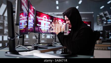 Ransomware Cyber Attack On Hacker Computer. Virus on Screen Stock Photo