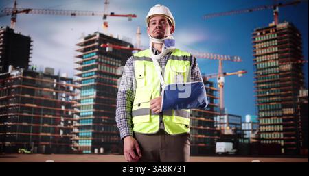 Injured Worker With Broken Arm. Construction Job Injury Stock Photo