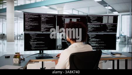 Software Engineer Debugging Code At Desk For Web Development Project Stock Photo
