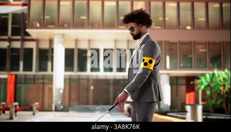 Young blind doctor video chatting while walking on sidewalk with cane. Stock Photo