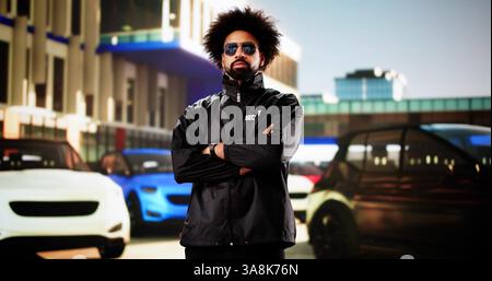 On-duty Security Guard Watches Over Crowded Car Parking Lot. Stock Photo