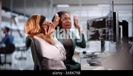 Unhappy developer stressed coding software on computer in office. Frustrated. Stock Photo