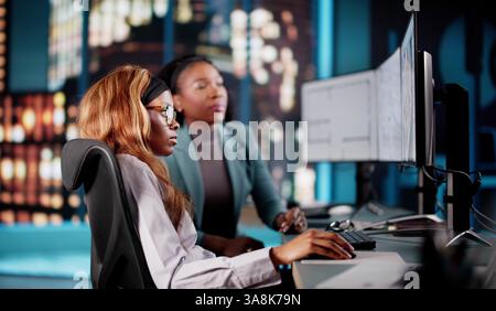 Female architect using CAD software to design virtual house model. Stock Photo