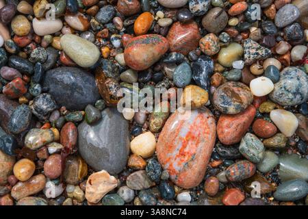 Colourful pebbles, cove near Hynish, Isle of Tiree, Inner Hebrides, Scotland Stock Photo