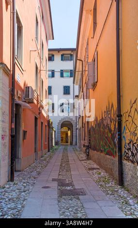 Udine, Italy - July 9 2024. Vicolo Brovedan, an historic narrow street in Udine. Houses from C18th-19th, the street is likely to have medieval origins Stock Photo