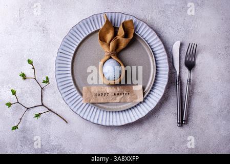 Elegant Easter table setting with painted egg Stock Photo