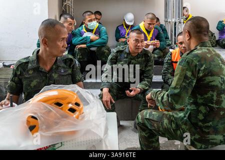 Bangkok, Thailand. 29th Mar 2025. The officers of the army are seen having a meeting at the collapsed State Audit Office building in Chatuchak district. On March 28, 2025, a powerful 7.7-magnitude earthquake in Myanmar triggered strong tremors causing the collapse of a 33-story under-construction skyscraper near Chatuchak Park. At least eight people have been confirmed dead with many more injured.Rescue operations continued on March 29 as numerous workers remained unaccounted for. Credit: SOPA Images Limited/Ģ����ý Live News Stock Photo