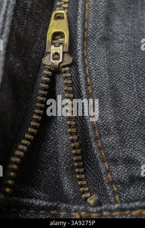 Close-up detail of a zipper on a pair of blue jeans Stock Photo