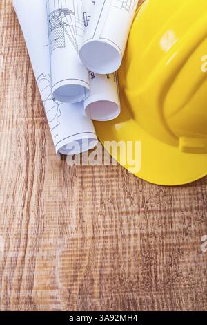 blueprints and yellow helmet on white table Stock Photo - Alamy