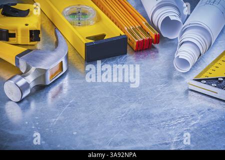 Variation of building working tools on metallic background construction concept/ Stock Photo