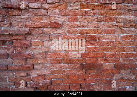 Old red brick background at natural light Stock Photo