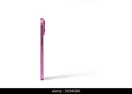 Slim pink smartphone side view on white background. Clipping path included Stock Photo