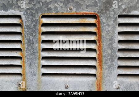 Rusty air vents on a steel textured background Stock Photo